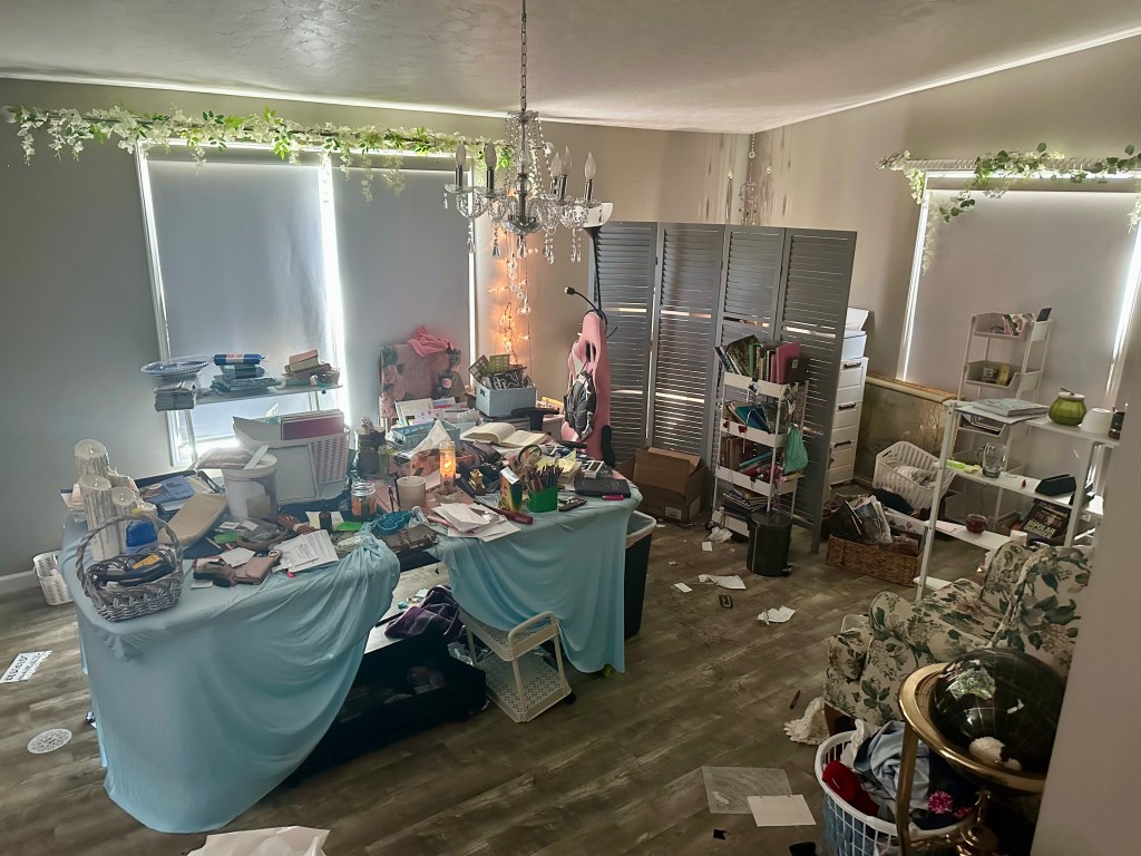 416305949_122136837260070980_9084111237844308841_n Multipurpose office and studio before editing, with work surfaces, storage and project materials filling the room.