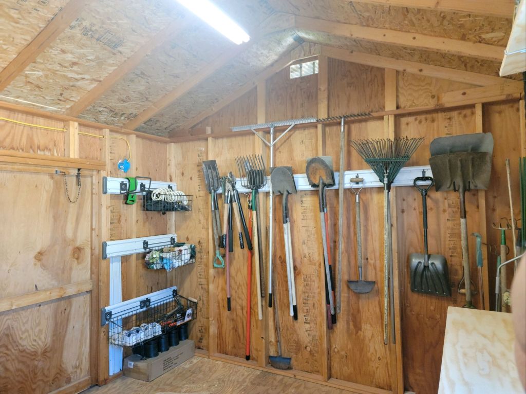 417727937_122136837686070980_6663586432814649480_n Garden shed after editing, with existing supplies organized and open floor space restored.