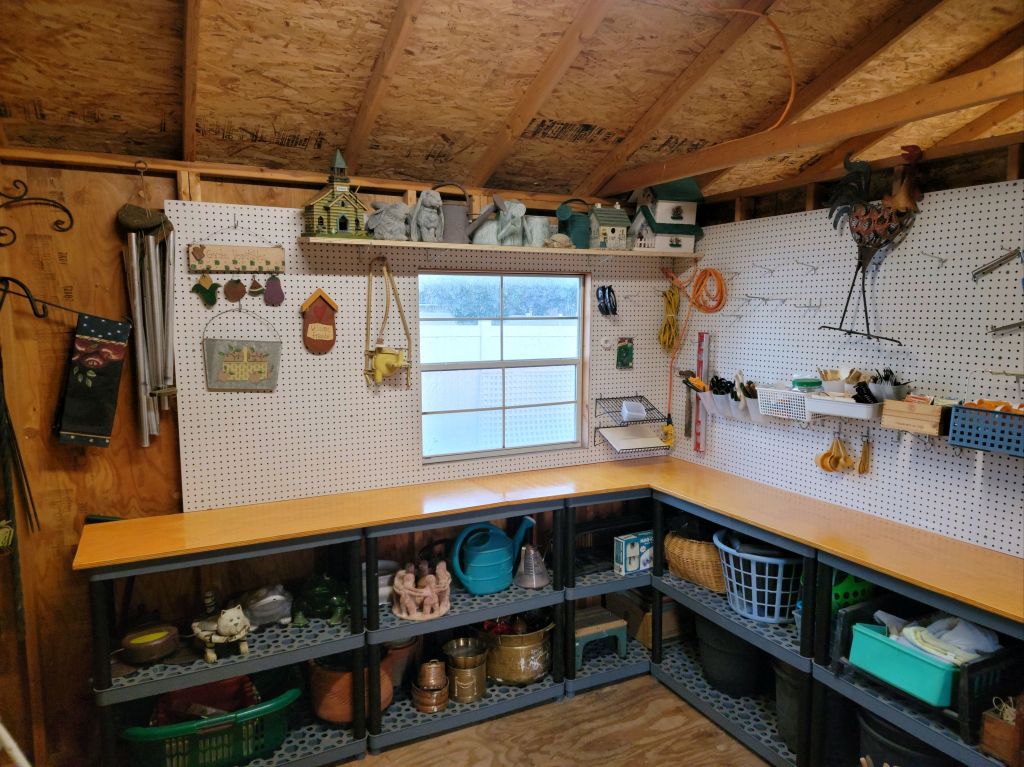 Garden shed after editing, with tools and gardening supplies organized into accessible storage zones.